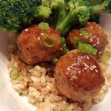 Soy Vay® Hoisin Garlic meatballs and broccoli on top of brown rice